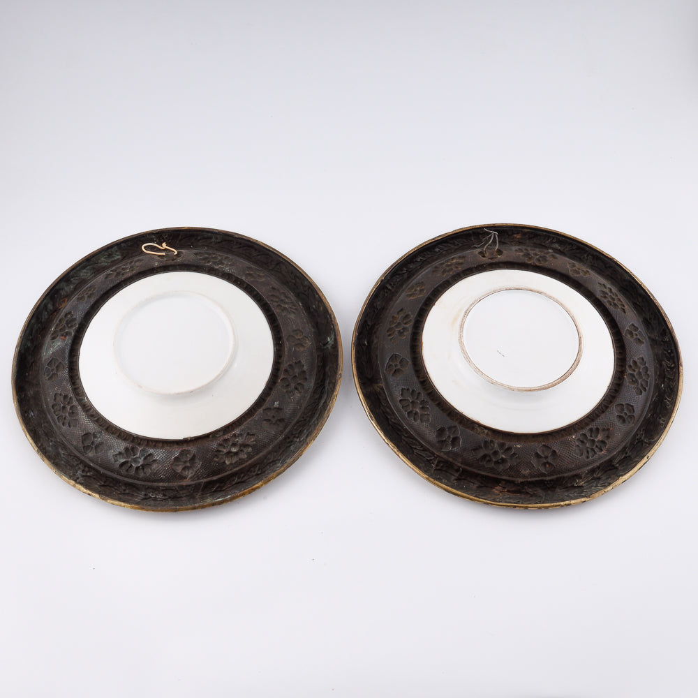 Pair of French 19th century wall décor plates showcasing brass craftsmanship and hand-painted fajans