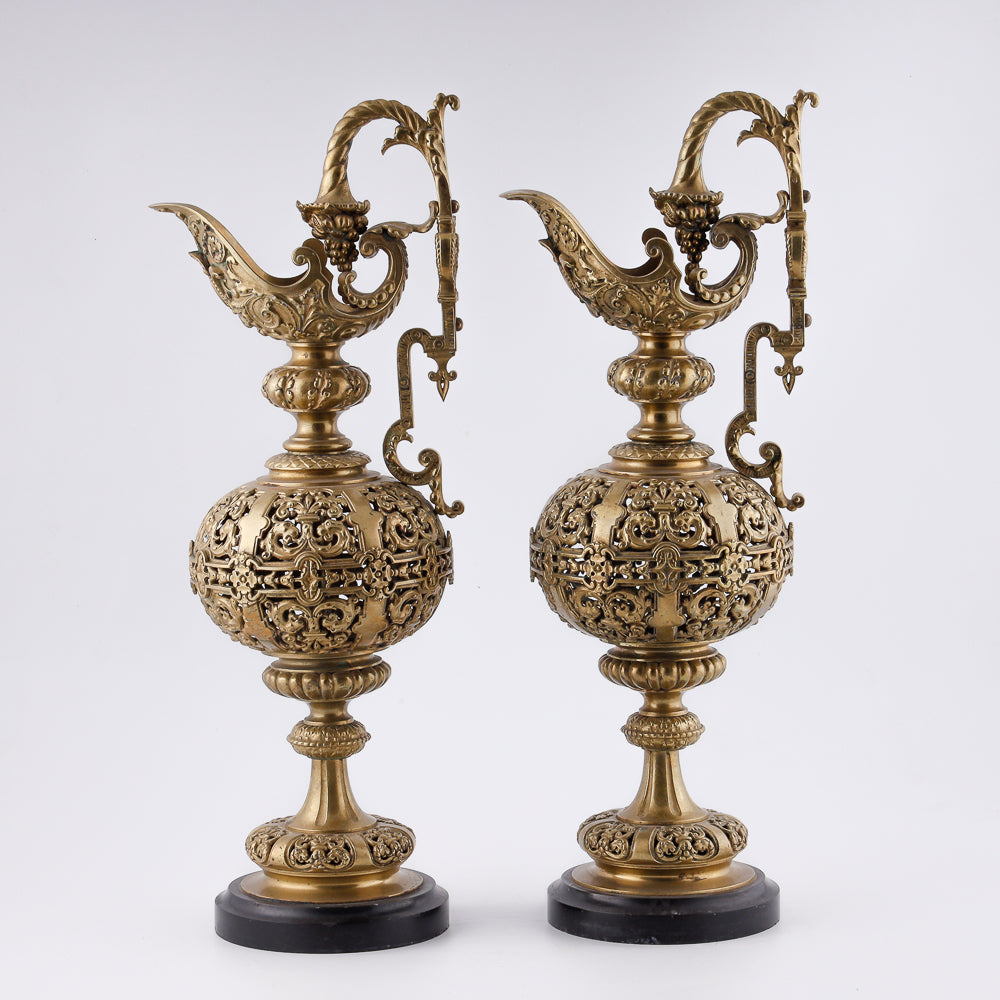 A pair of antique 20th-century decorative vases featuring Asian-inspired design