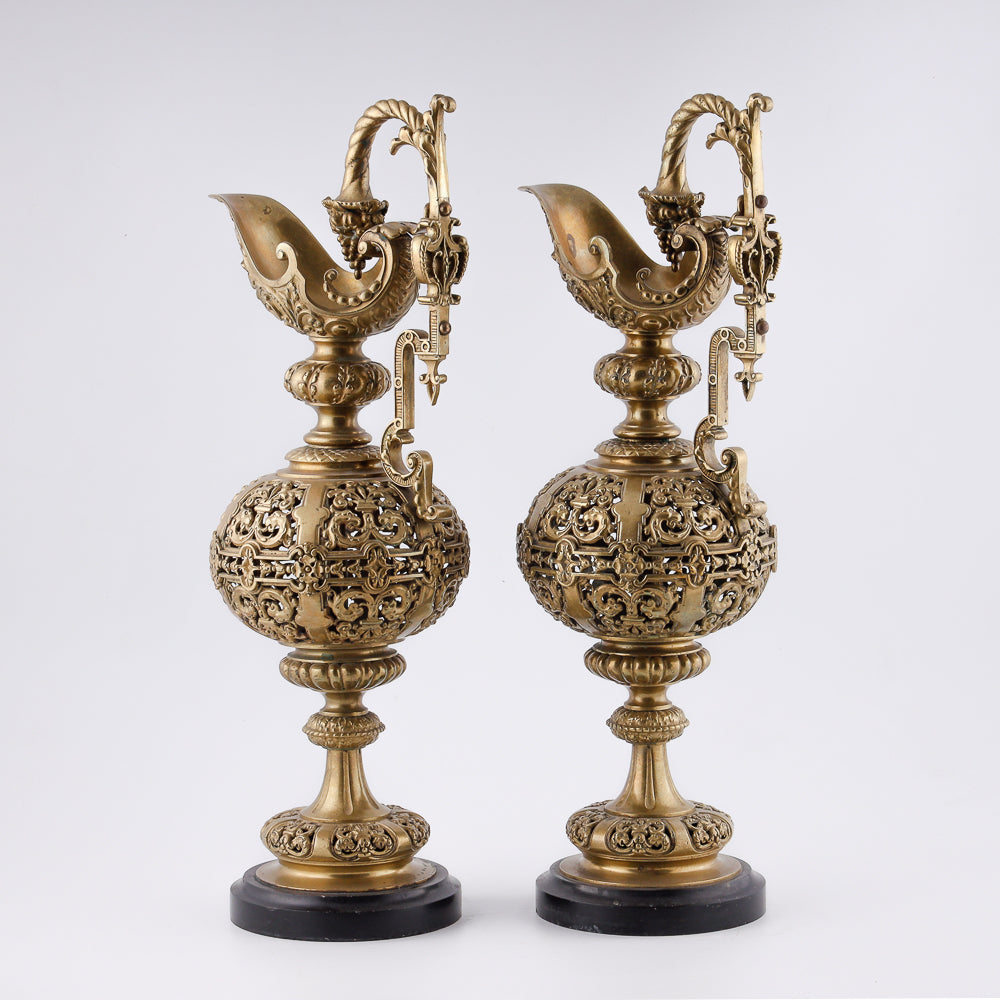 A pair of antique 20th-century decorative vases featuring Asian-inspired design