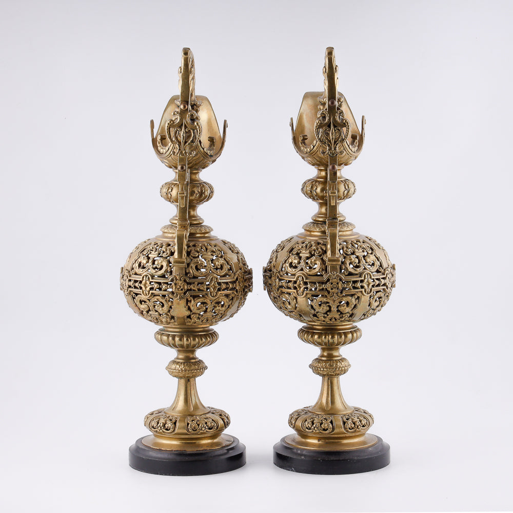 A pair of antique 20th-century decorative vases featuring Asian-inspired design