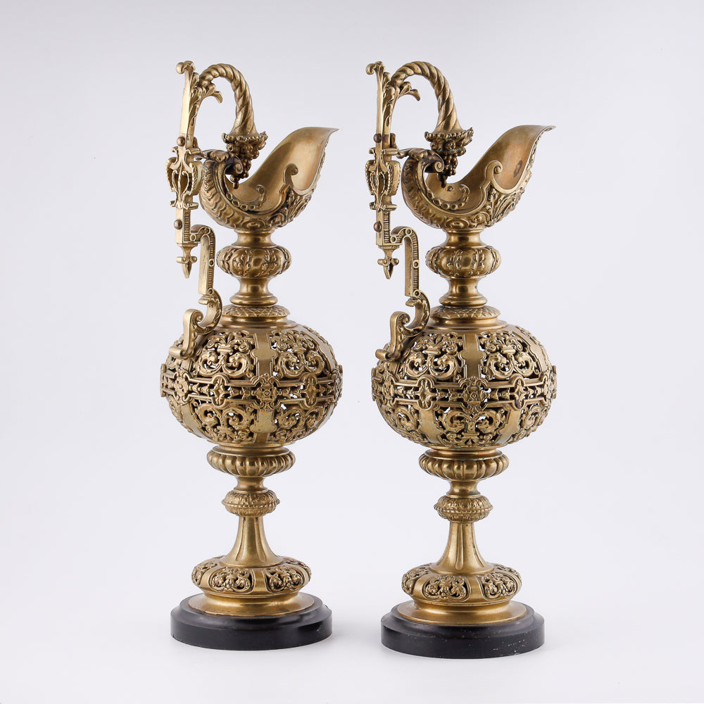 A pair of antique 20th-century decorative vases featuring Asian-inspired design