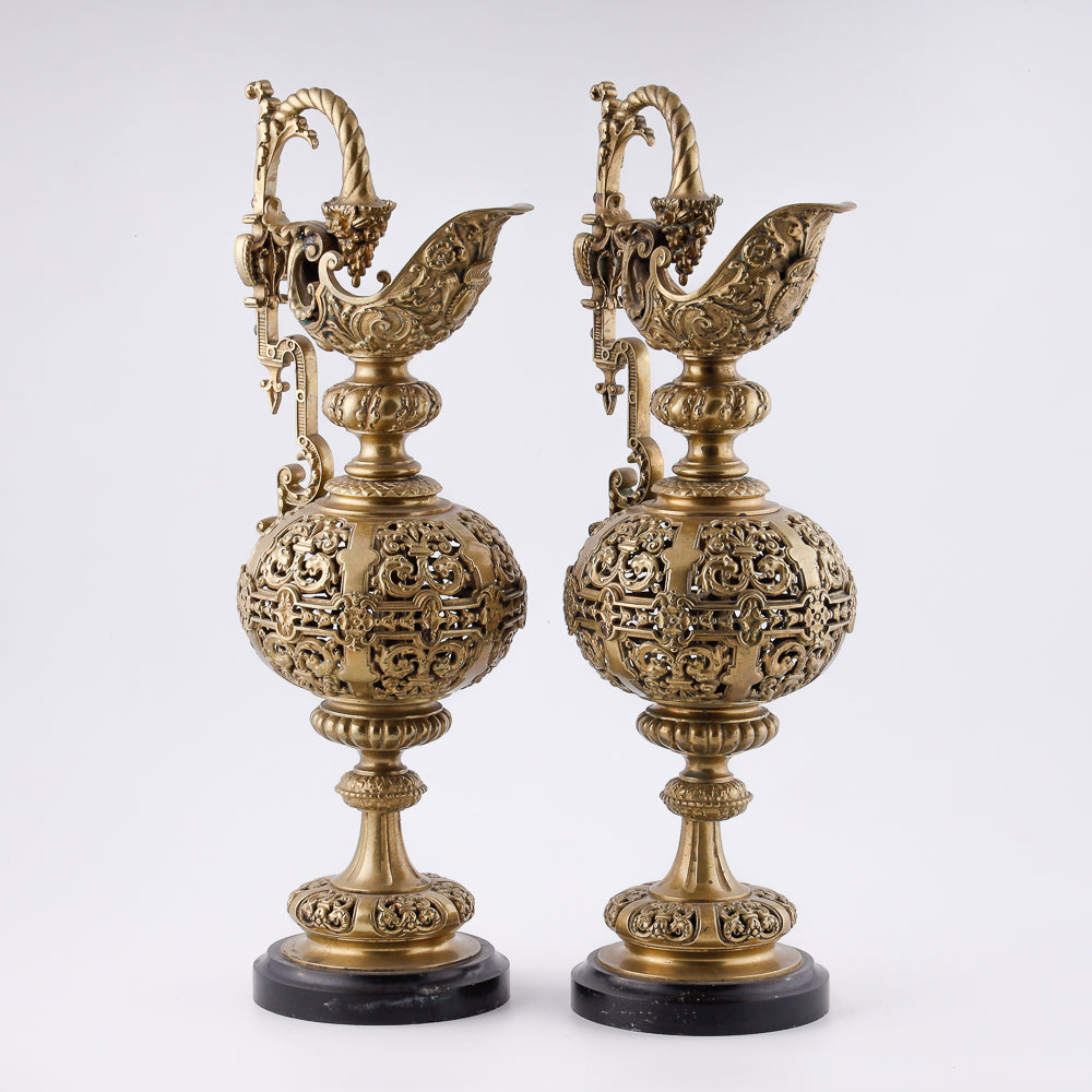 A pair of antique 20th-century decorative vases featuring Asian-inspired design