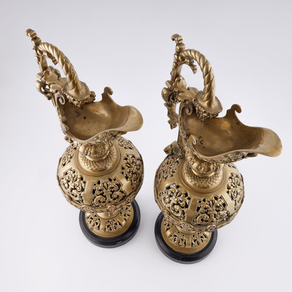 A pair of antique 20th-century decorative vases featuring Asian-inspired design