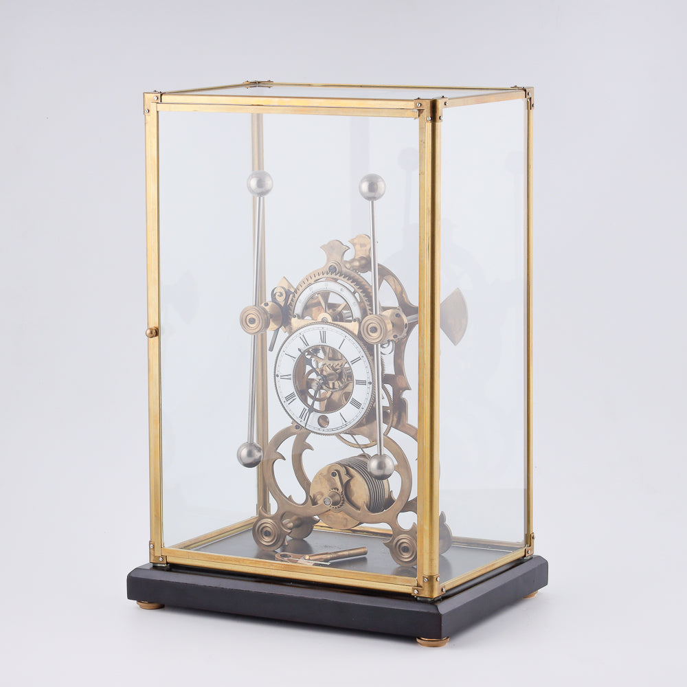 vintage Fusee Skeleton clock features a translucent glass design that showcases its intricate inner workings
