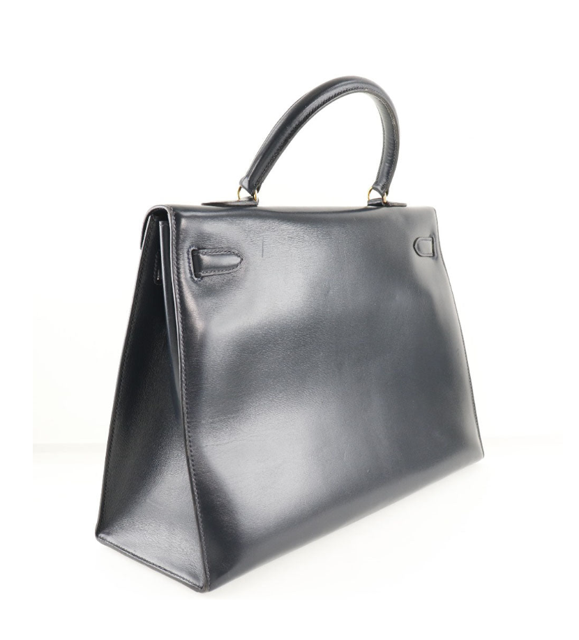 Hermés Kelly 25cm Correa de piel de becerro azul marino y con caja