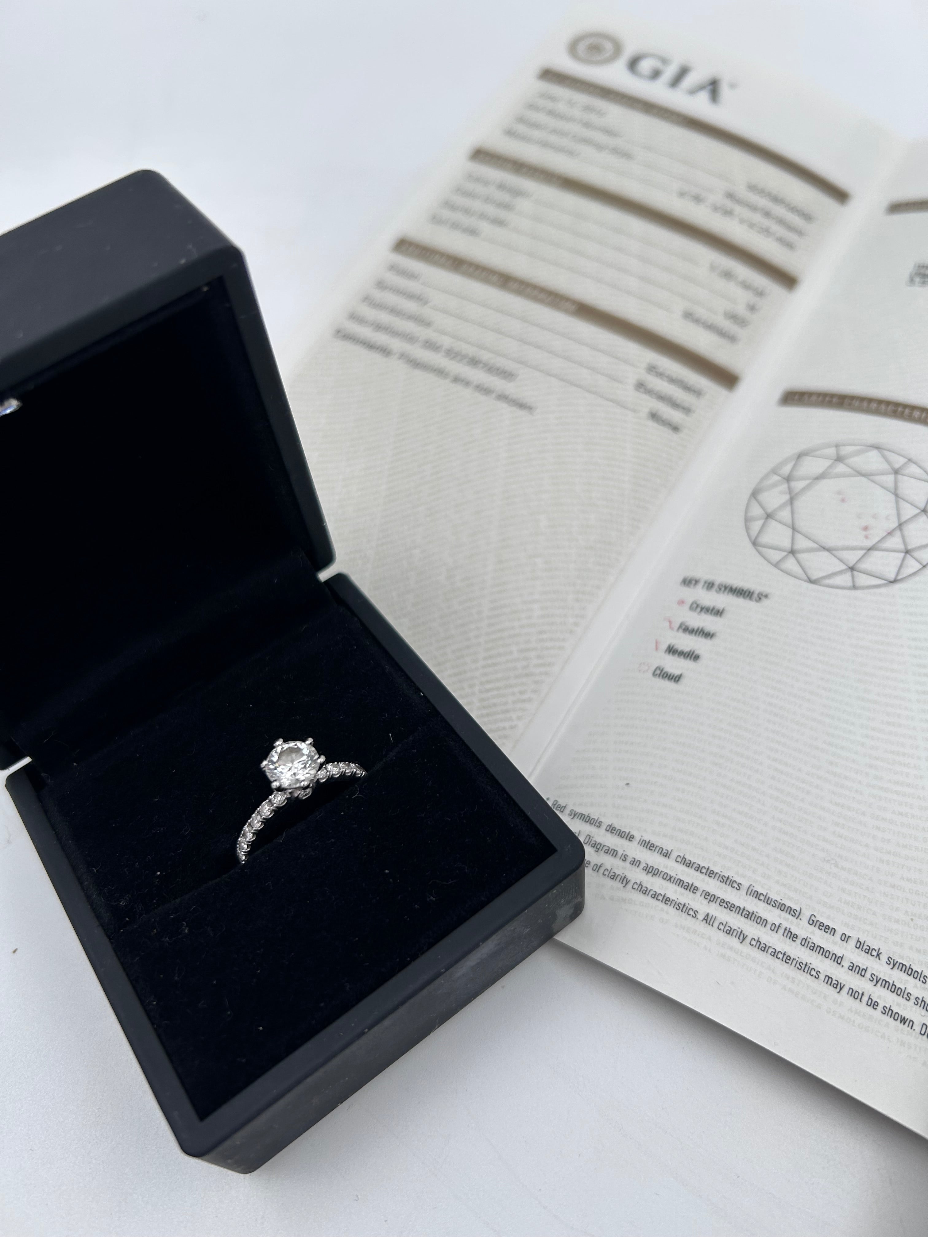 Pre-owned solitaire ring featuring a natural 1.20ct round brilliant diamond (VS2, H color)