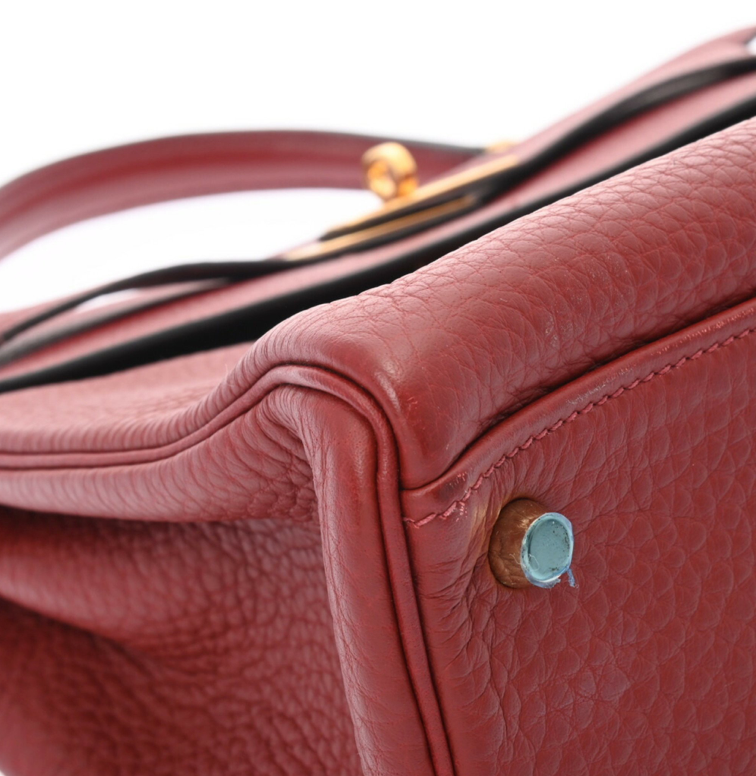 Hermes Kelly 32 in a red leather with a strap and accessories