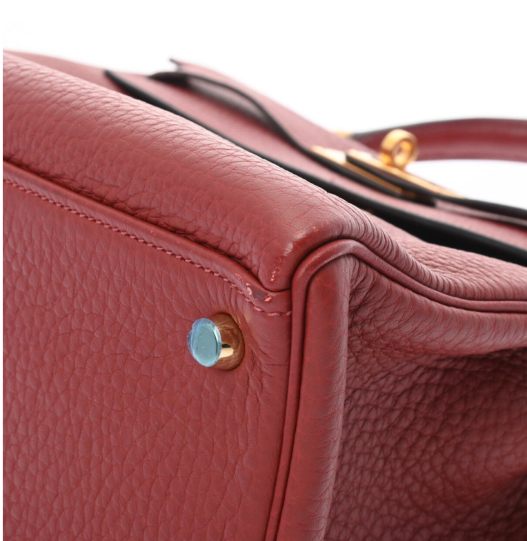 Hermes Kelly 32 in a red leather with a strap and accessories