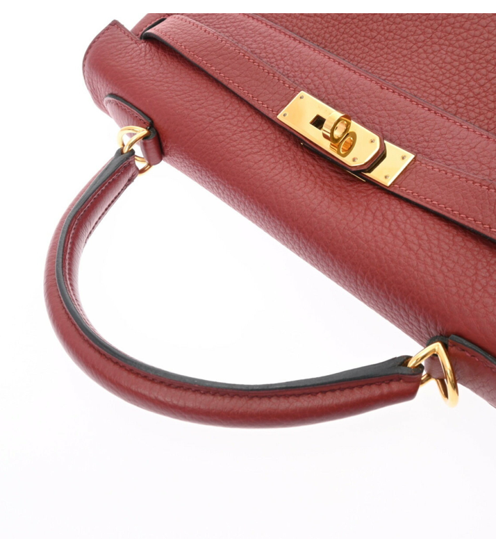Hermes Kelly 32 in a red leather with a strap and accessories
