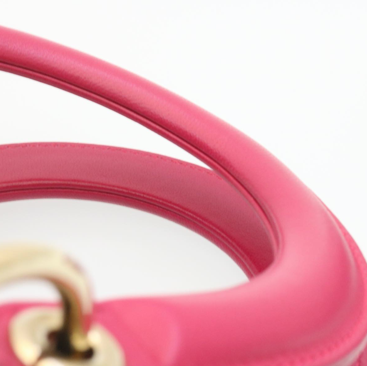 Lady Dior mini handbag in fuchsia lambskin leather with a long strap