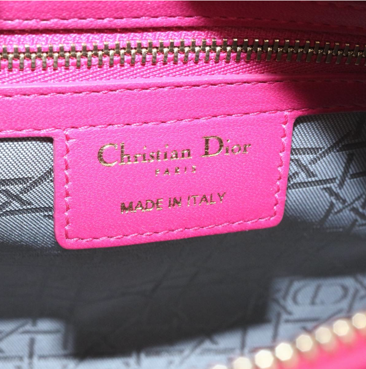 Lady Dior mini handbag in fuchsia lambskin leather with a long strap