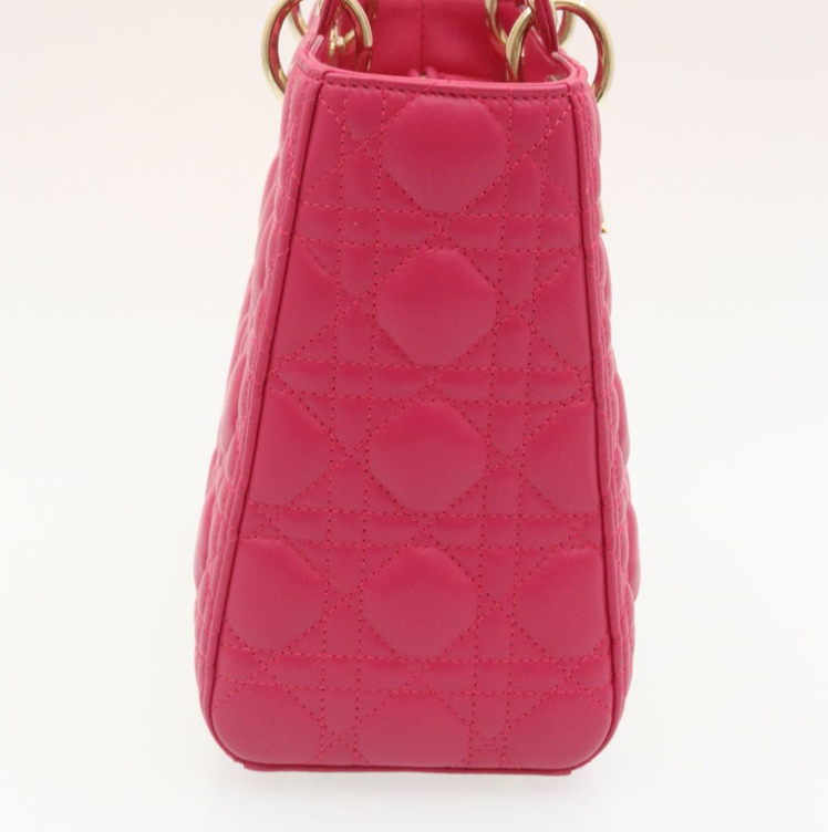 Lady Dior mini handbag in fuchsia lambskin leather with a long strap