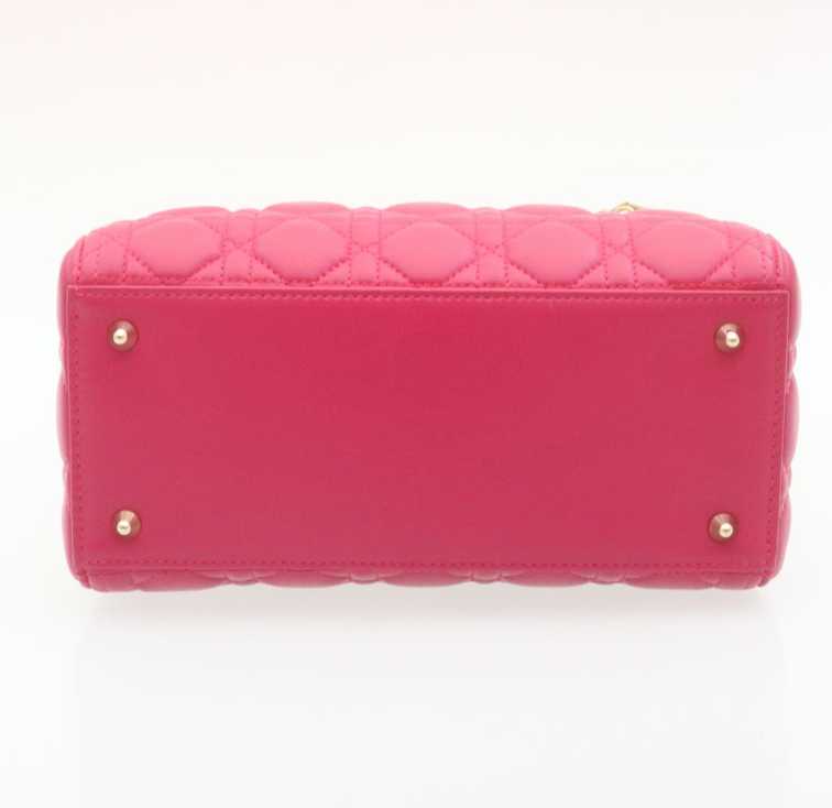 Lady Dior mini handbag in fuchsia lambskin leather with a long strap