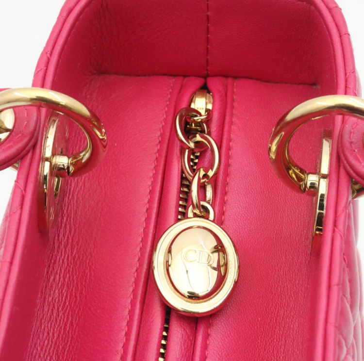 Lady Dior mini handbag in fuchsia lambskin leather with a long strap