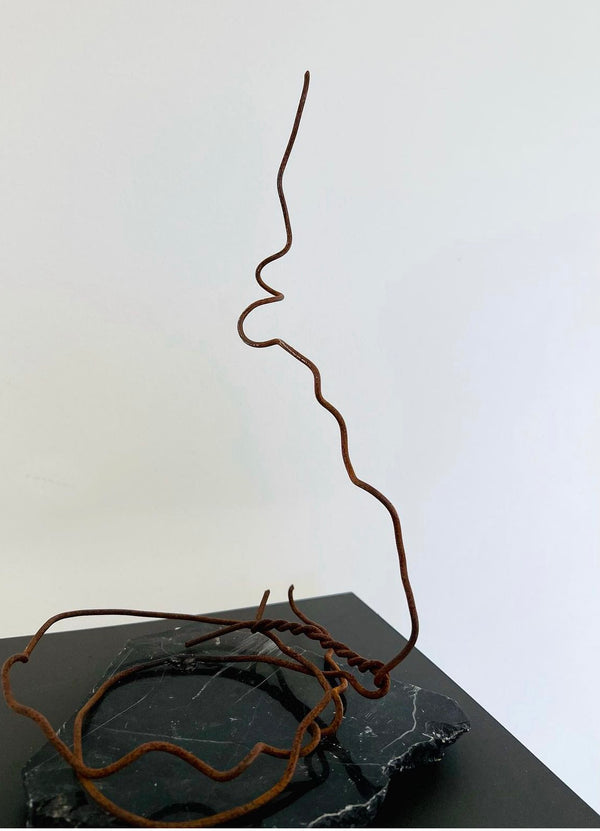 A Metal sculpture "Untitled" (Bez nosaukuma) on a stone base by Ieva Bondare