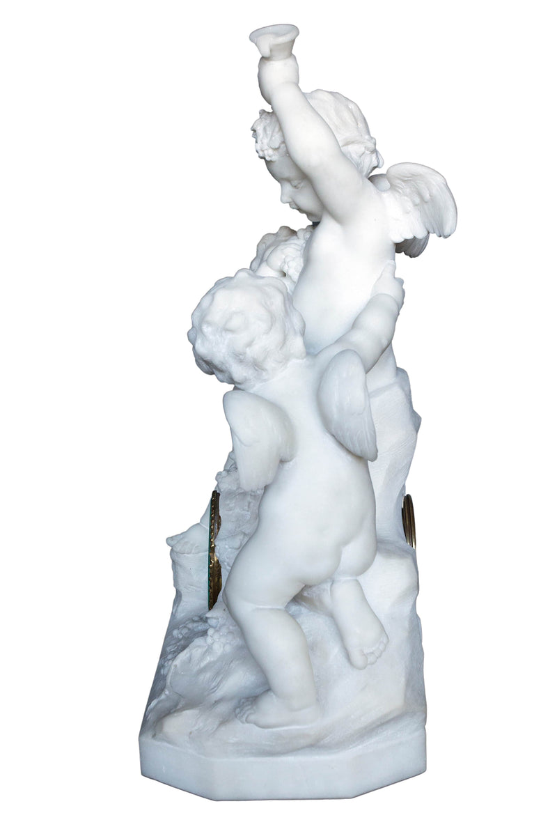 Carrara marble clock made in a shape of a sculpture depicting angels