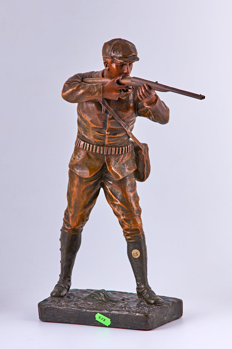 Patinated spelter statuette of a hunter by Henri Fugere