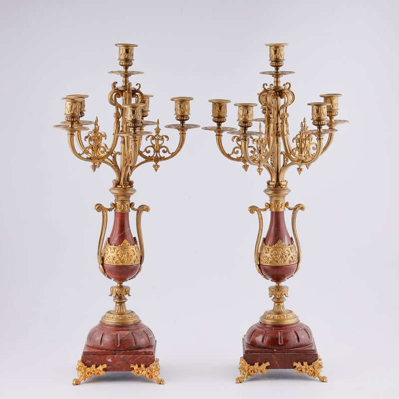 A set of two antique exquisitely gilded bronze candelabras