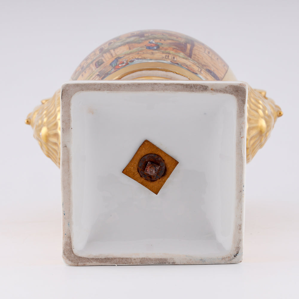 Antique porcelain vase in classical form with gold plated handles in the form of swans