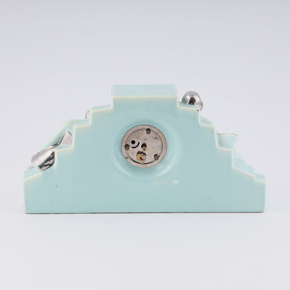 Fajance Art Deco clock shaped in a pedestal form with two elegant ballerinas sitting gracefully at each side
