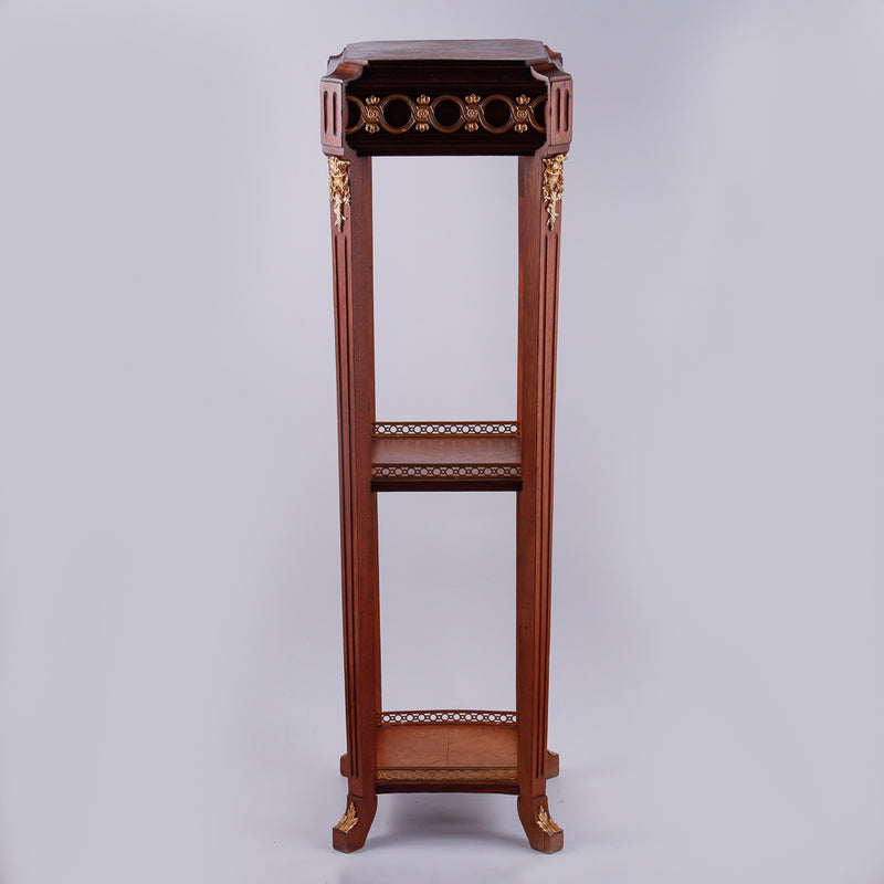 Mahagony hand-carved console with gold-painted Neoclassical decorative ornaments.
