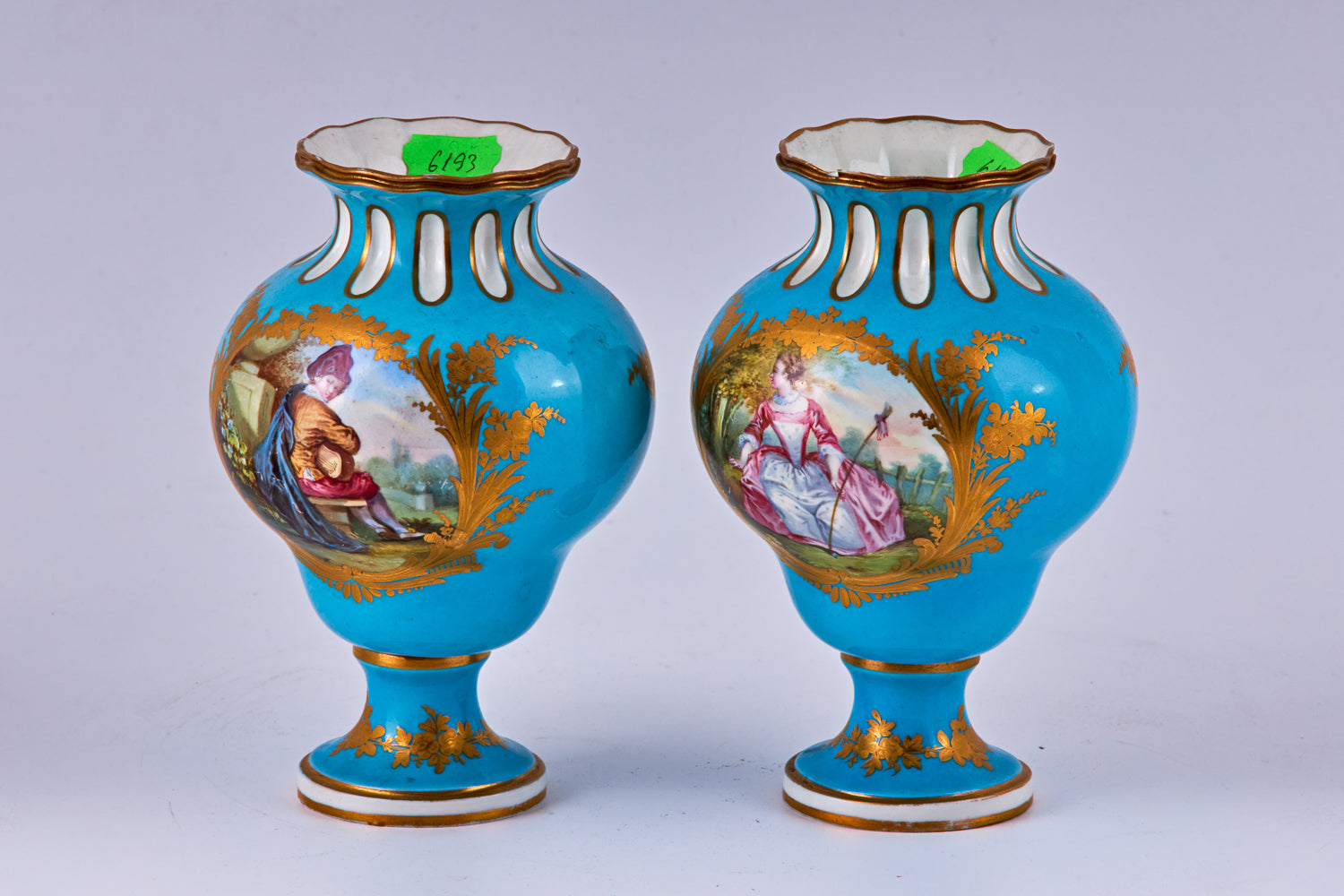 Pair of Sevres blue hand painted porcelain vases with polychromatic decoration