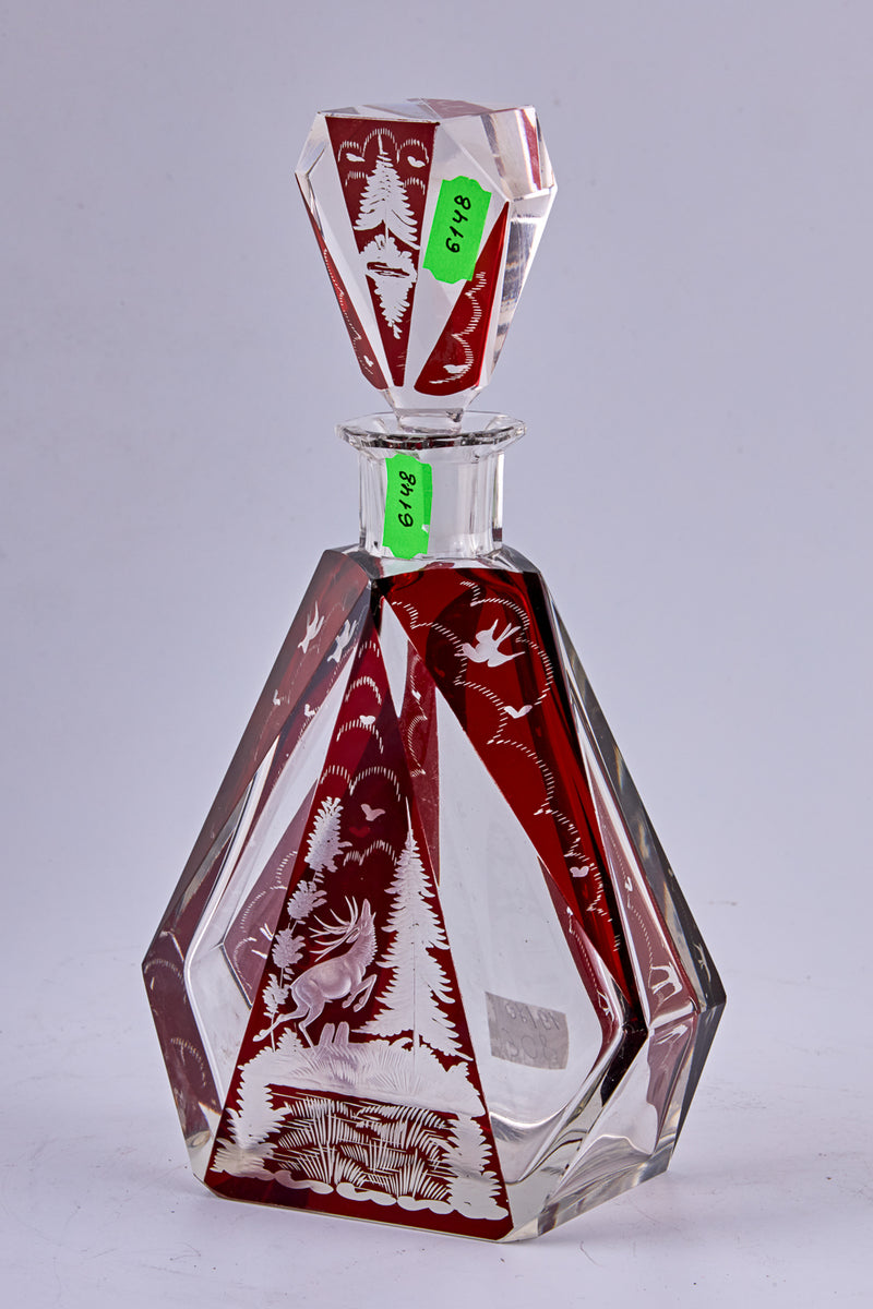 A stunning Czechoslovakian hand-carved crystal vodka carafe with 6 vodka cups
