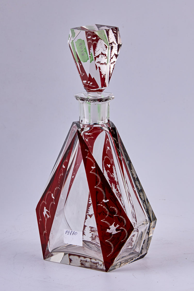 A stunning Czechoslovakian hand-carved crystal vodka carafe with 6 vodka cups