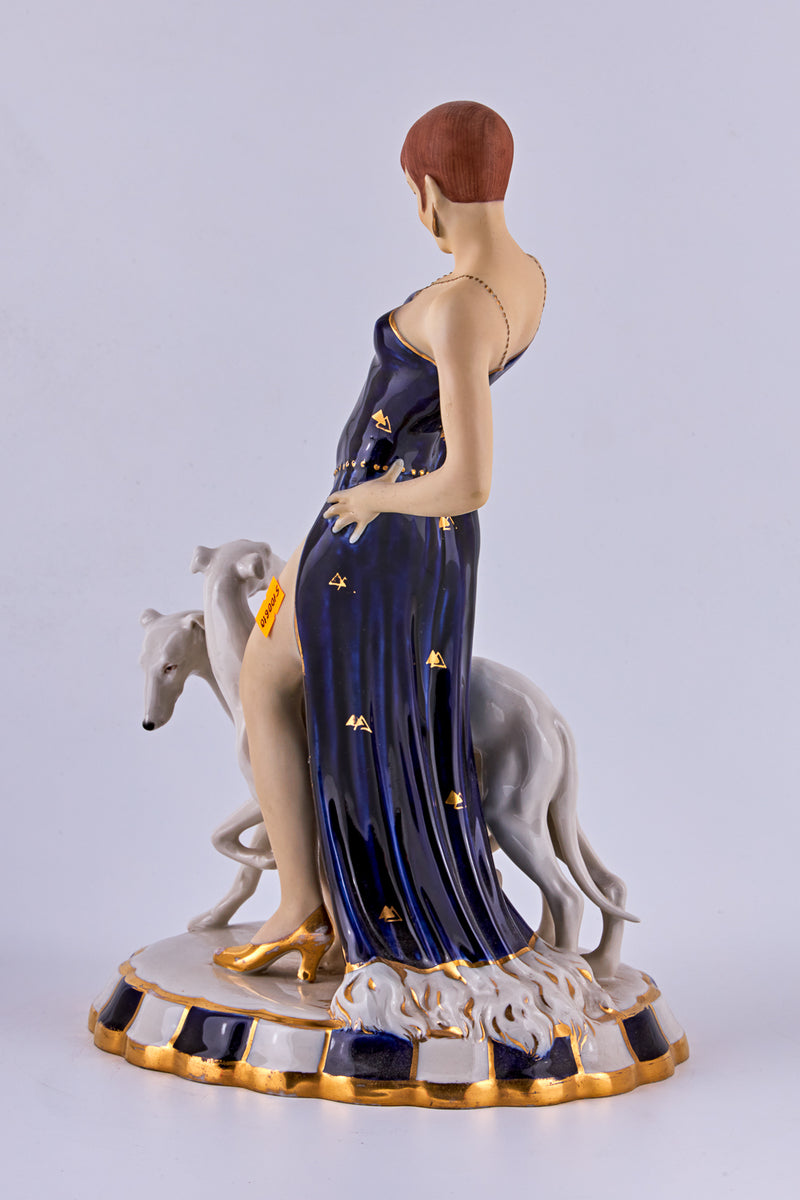 Porcelain Figurine of a “Flapper with two Borzoi dogs”