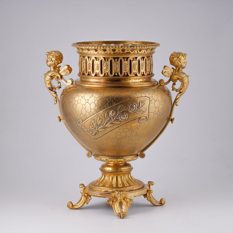 Gilt bronze large flower pot decorated with putti and floral motif