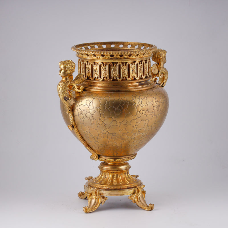 Gilt bronze large flower pot decorated with putti and floral motif