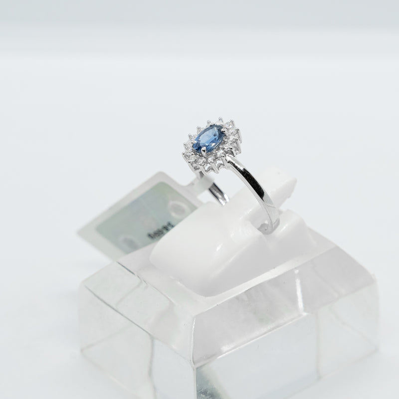 18k white gold ring set with a natural blue sapphire and natural diamonds