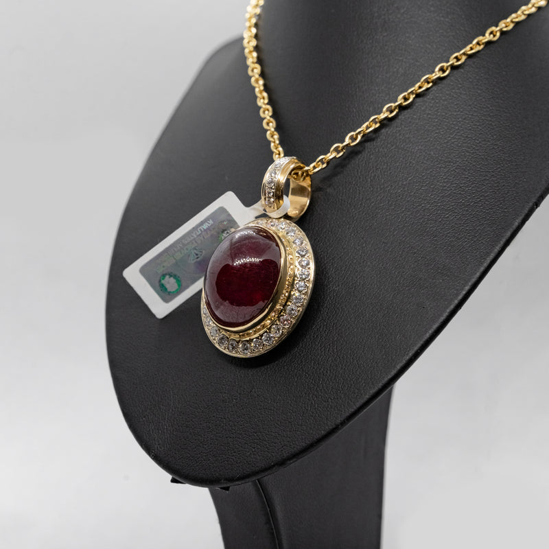 Vintage 14k yellow gold necklance with a pendant set with natural diamonds and Cabochon cut ruby