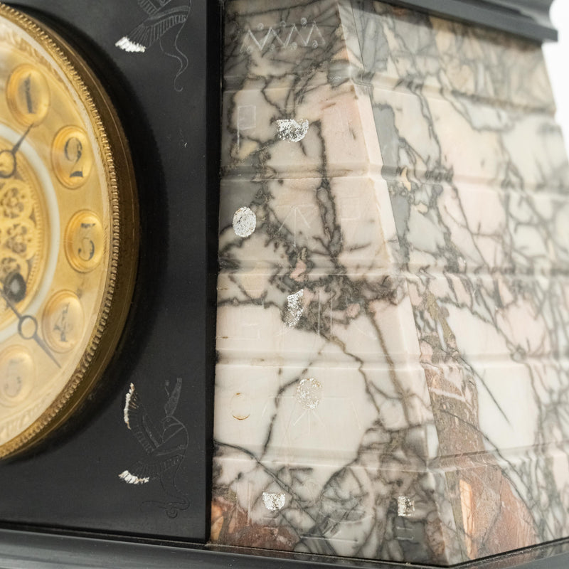 Antique marble mantel clock with an Egyptian motif decorated with a winged sphinx on top