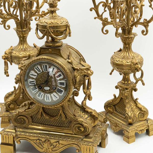 Antique Eclectic style bronze mantel clock with two candelabras in the style of Napoleon 3rd. decor