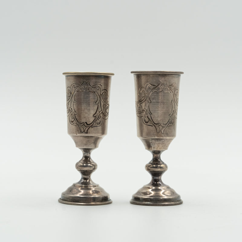 Pair of Russian sterling silver vodka cups by silversmith Sokolov
