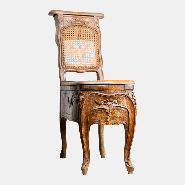 Exclusive and rare 19th-century bidet-chair decorated with floral ornaments with rattan weaving
