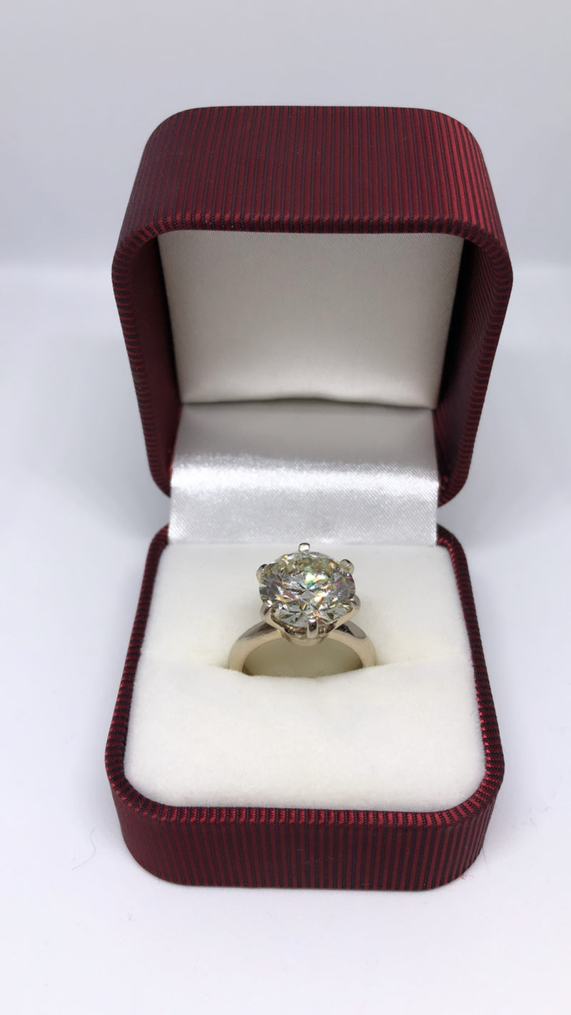 Solitaire ring with a GIA certified 6.55 carat SI1 clarity Round Brilliant cut diamond