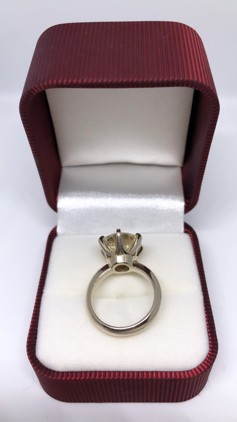 Solitaire ring with a GIA certified 6.55 carat SI1 clarity Round Brilliant cut diamond