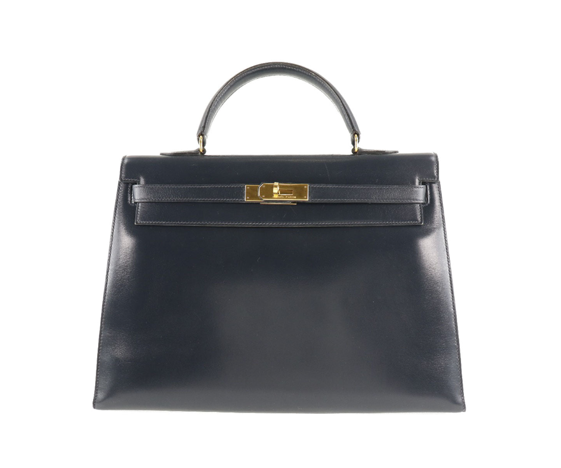 Hermés Kelly 25cm Correa de piel de becerro azul marino y con caja 