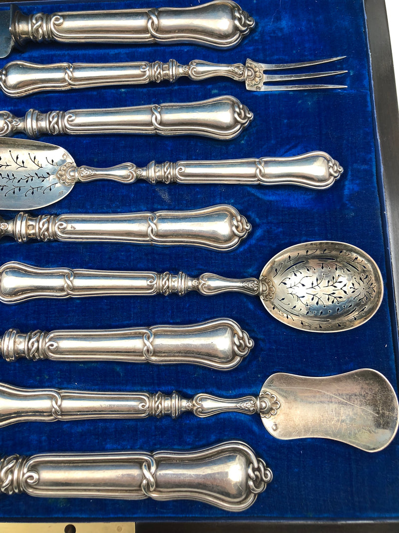Antique 19th-century French silver set for a table setting with decorative welt patterns.