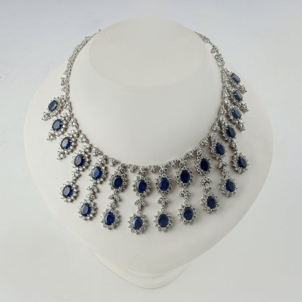 18k white gold drop necklace set with 24 ctw of natural diamonds & 37 ctw blue sapphires